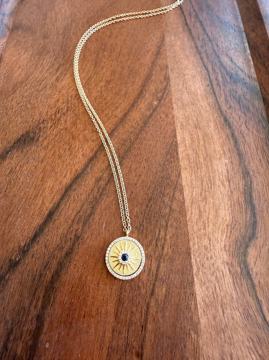 Spinning diamond and sapphire necklace